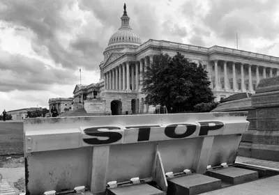 Safety barriers and stop sign in front of United States Capitol Safety barriers and stop sign in front of United States Capitol